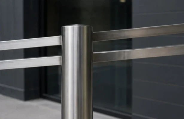 close-up of stainless steel bollard with horizontal rails in a modern architectural setting
